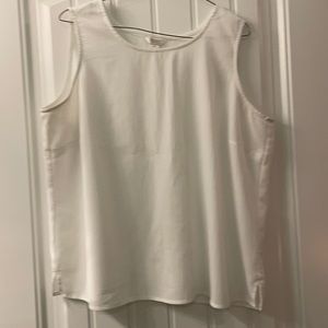Sleeveless white top. 2” Slits on both sides. Clean  No spots. Gently worn